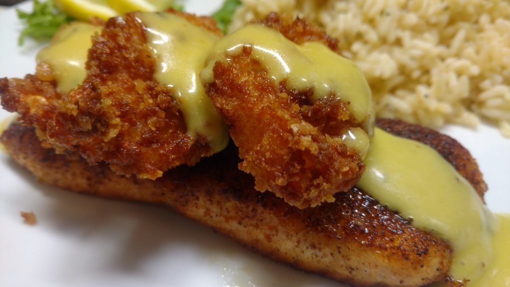 Blackened Salmon with Fried Shrimp. And topped with a lemon butter honey mustard sauce.